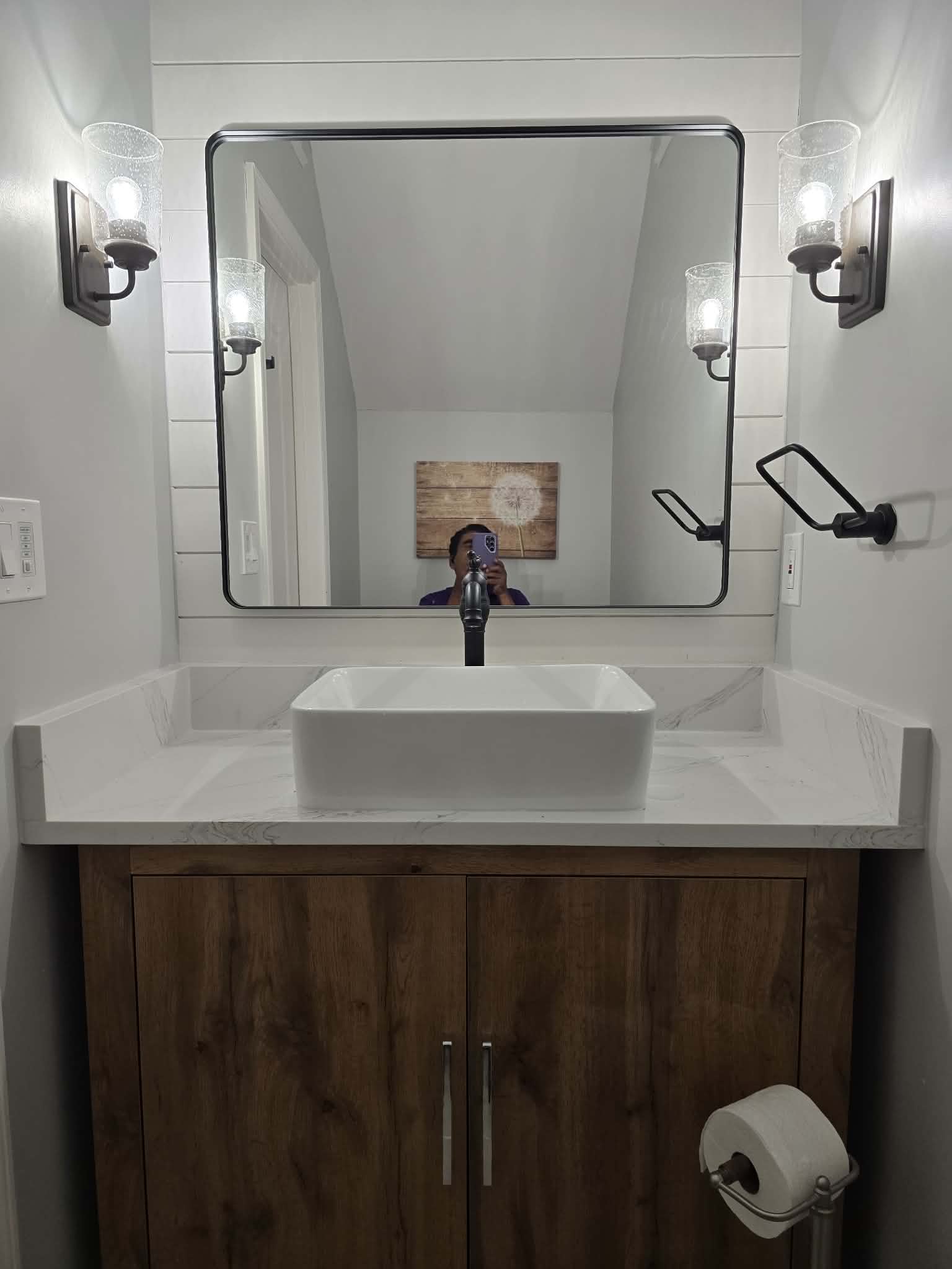 Bathroom vanity with vessel sink and matte black fixtures