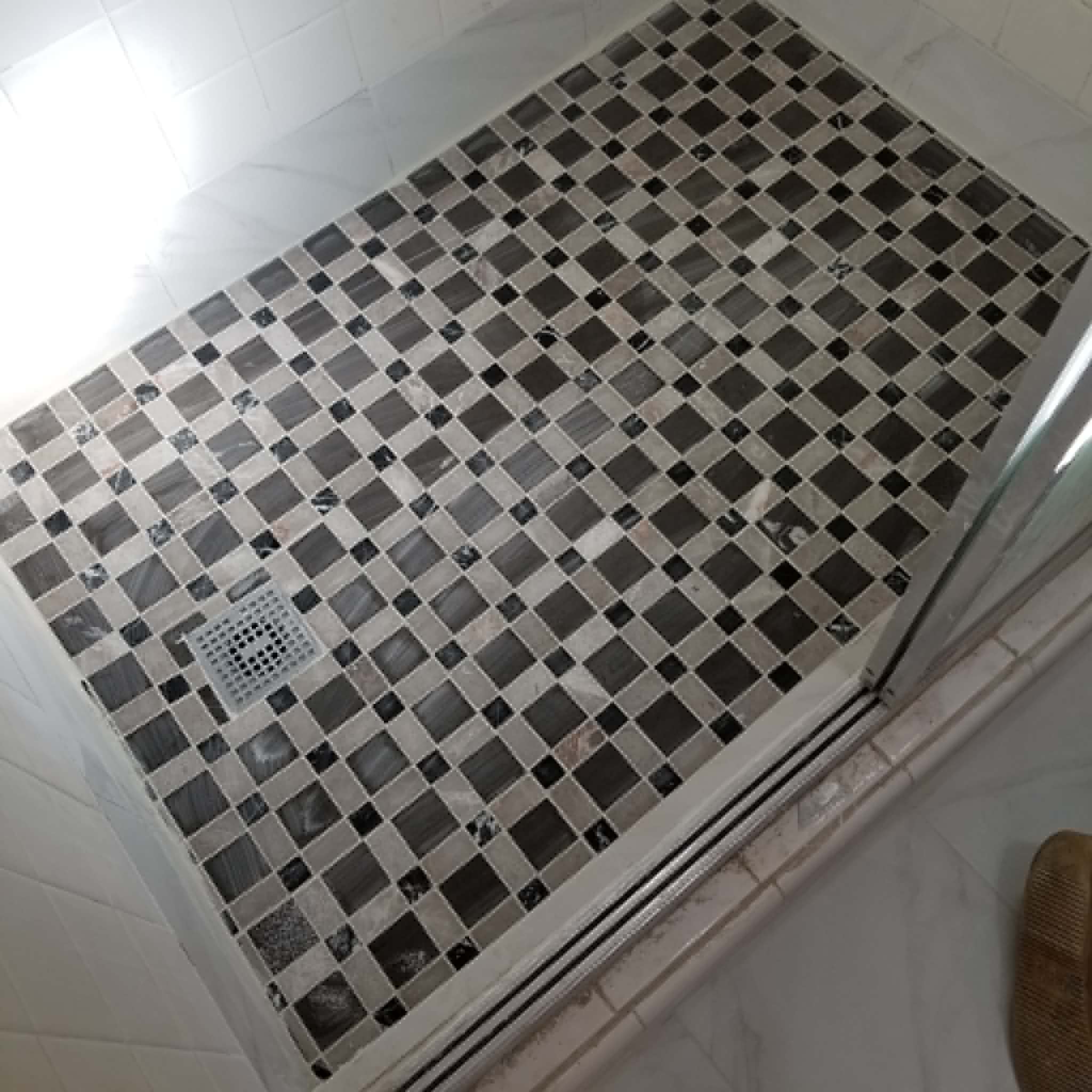 Custom mosaic tile shower floor